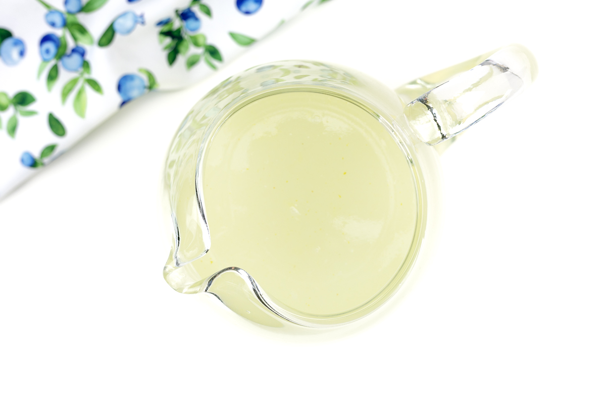 Lemon and water mixed in a pitcher.