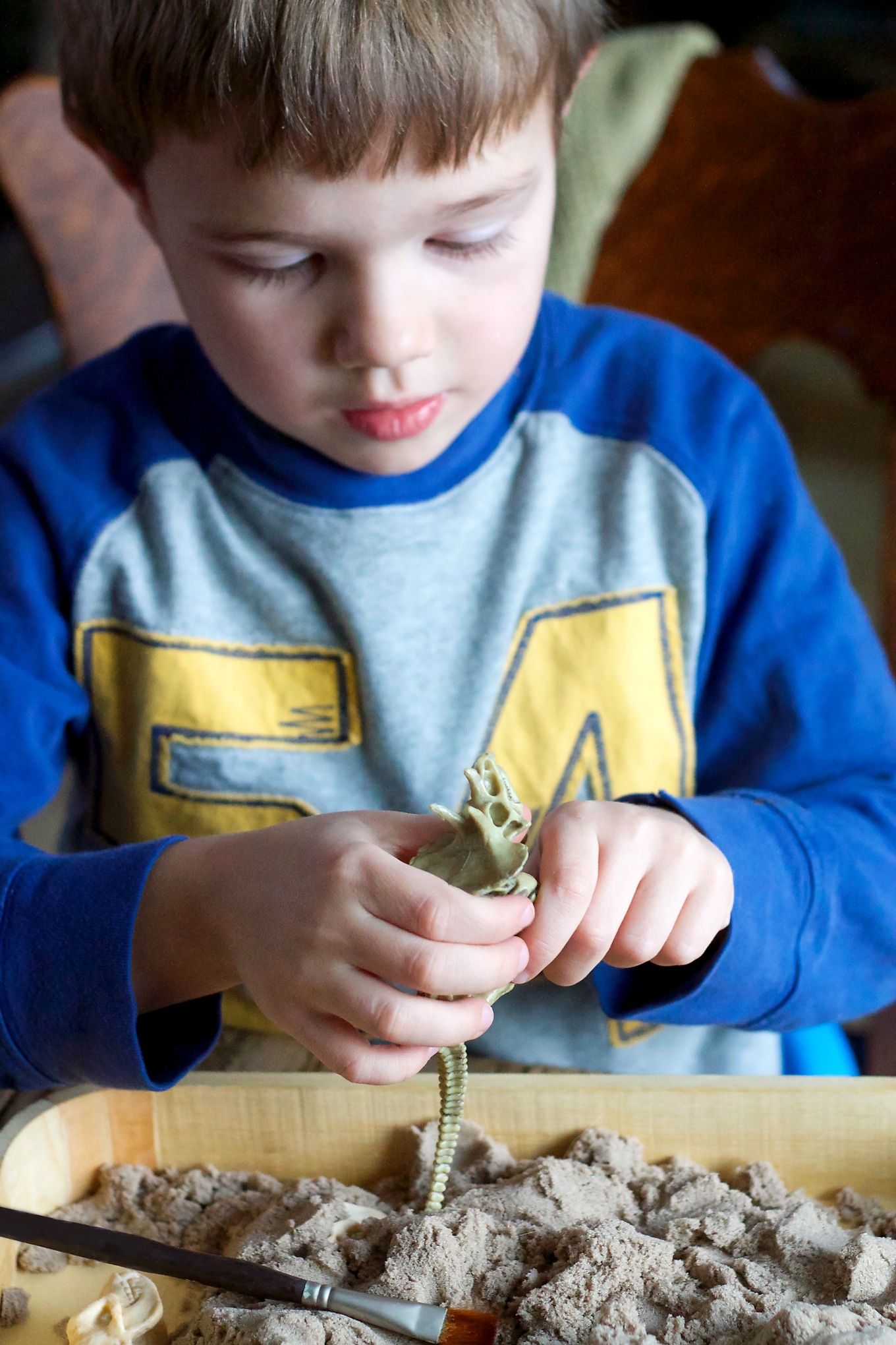 Preschooler Digging for Dinosaur Bones