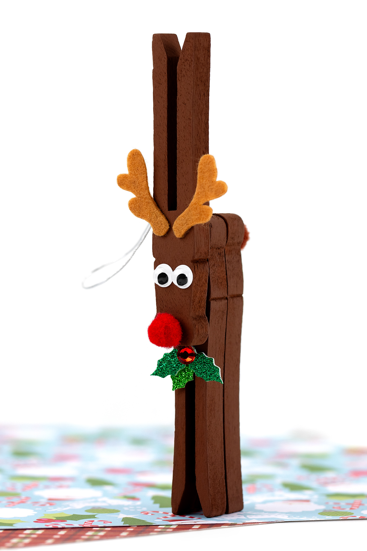 Clothespin transformed into a reindeer with felt and googly eyes.