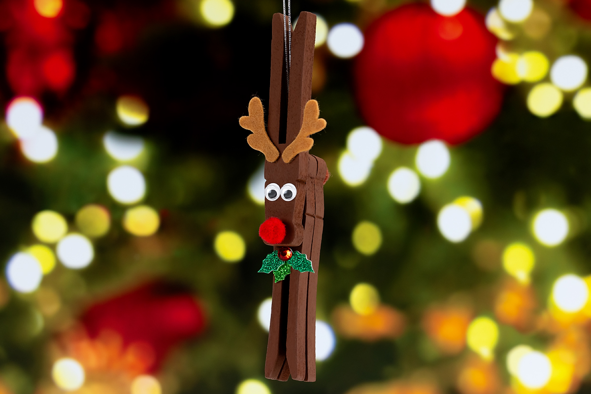 Reindeer Ornament hanging on a Christmas tree.