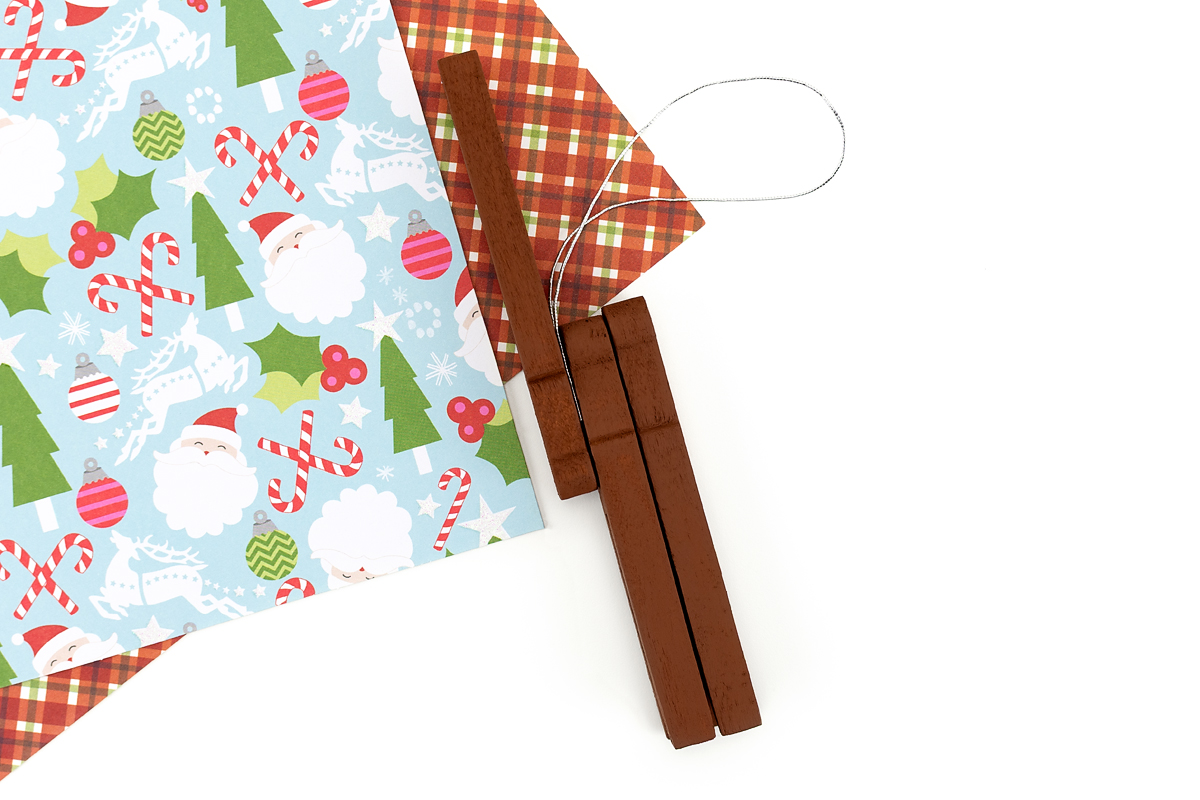 The wooden clothespin reindeer head is glued to the body with a ribbon loop added for hanging.