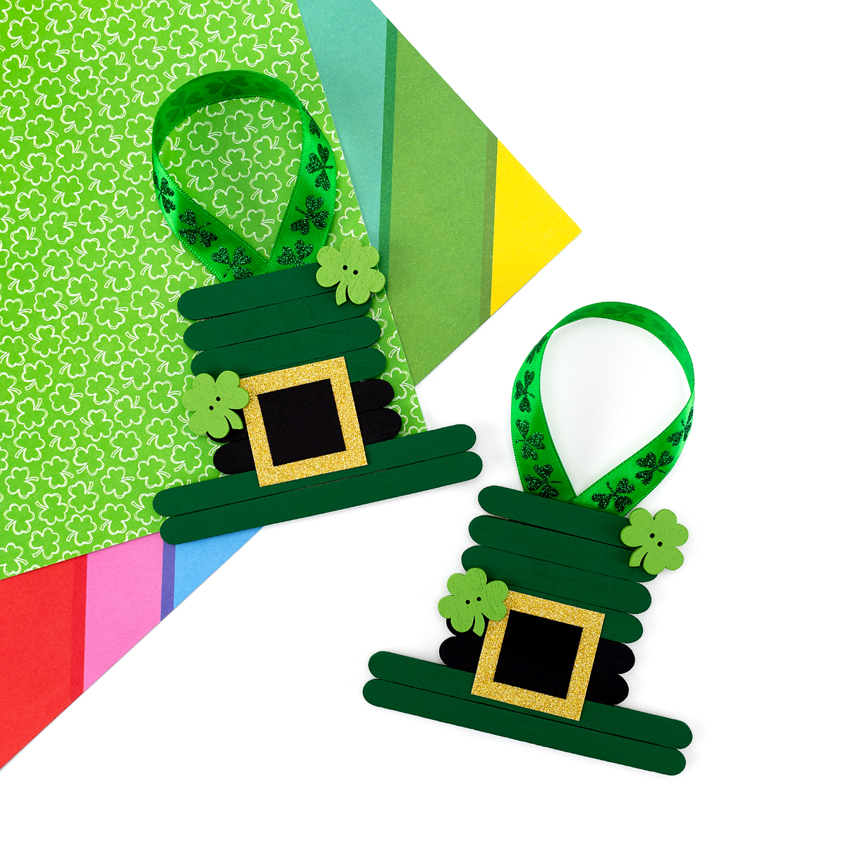 Two finished Leprechaun Hat ornaments on a table. 