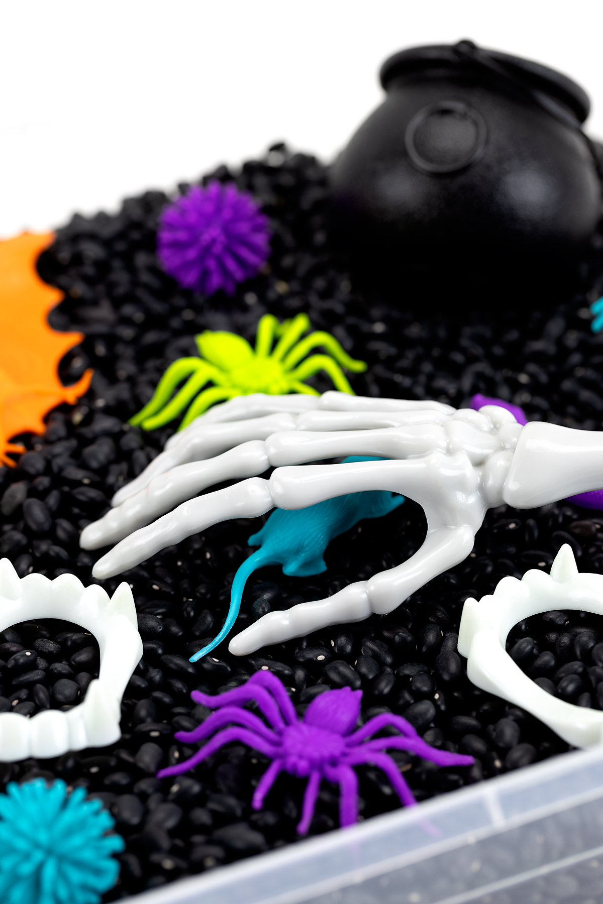 Halloween Sensory Bin with Skeleton Tongs Fun Halloween sensory bin for kids.