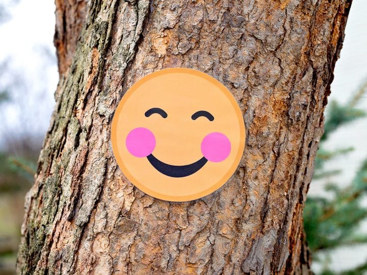 Blushing Smile Emoji on Tree