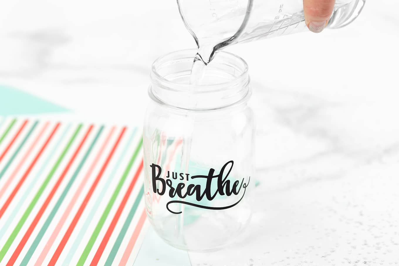 Pouring Water in Glitter Jar