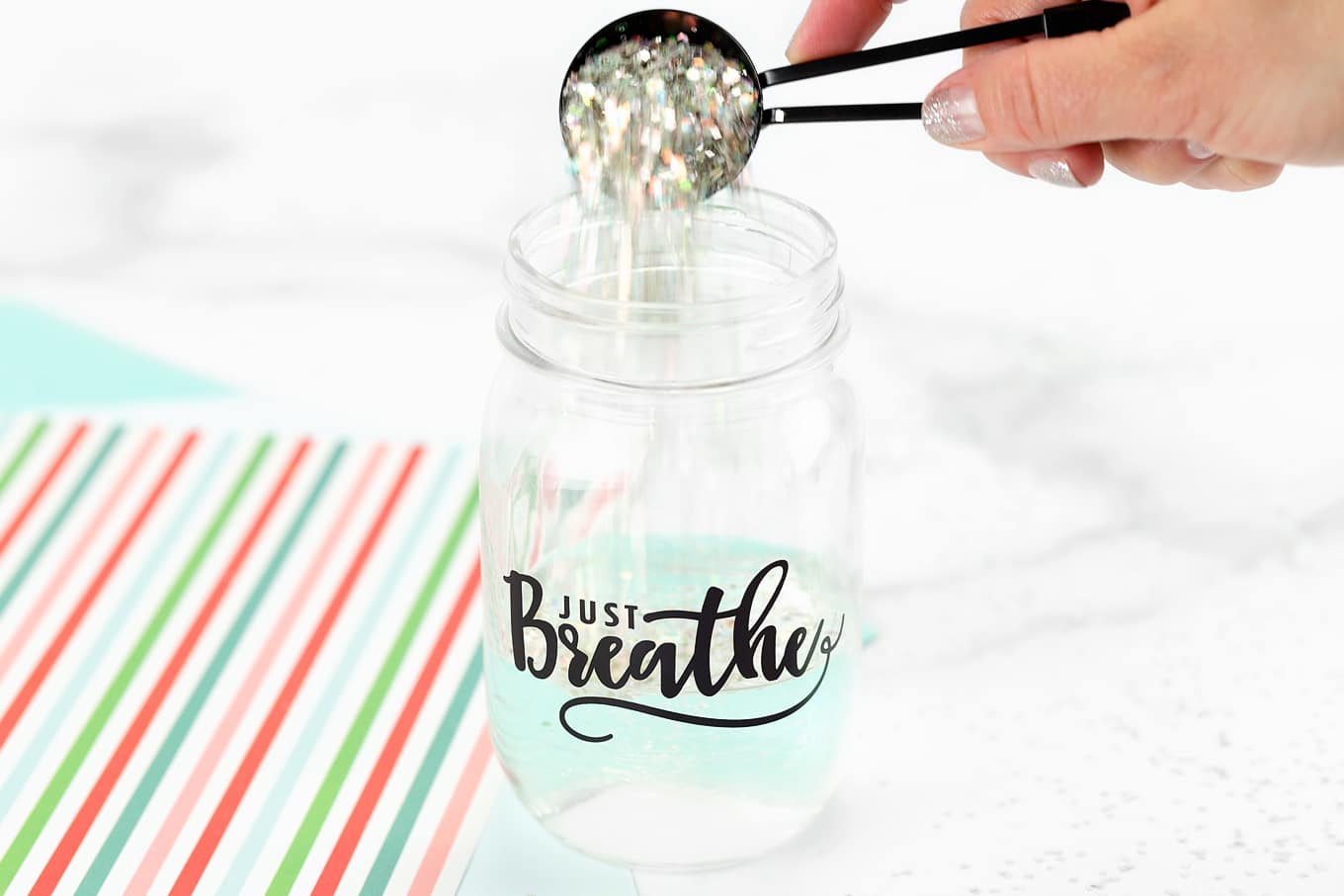 Pouring Glitter into Glitter Jar