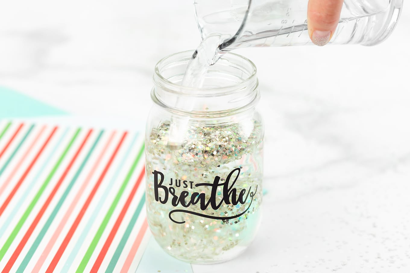 Pouring Water into Glitter Jar