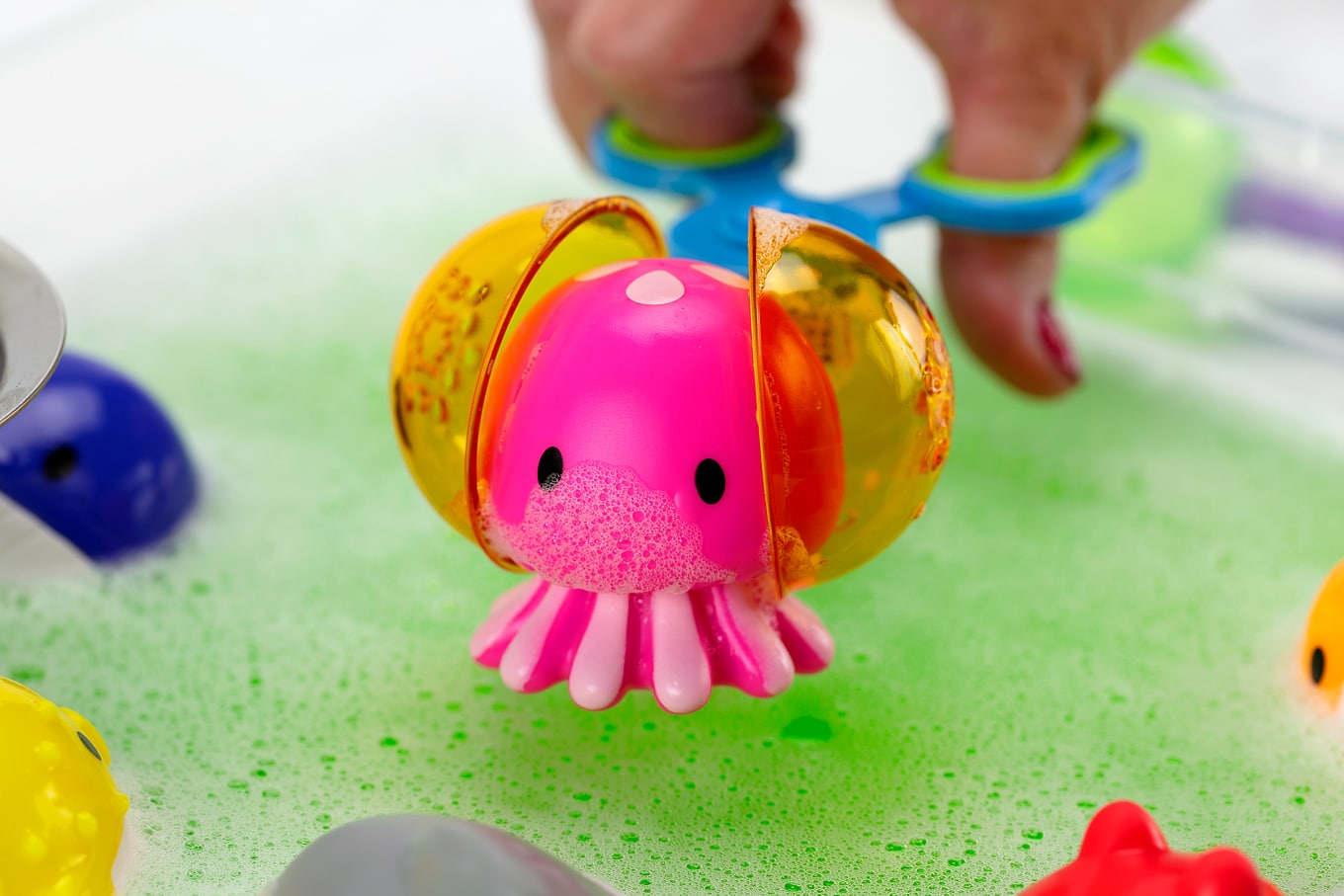Octopus Bath Squirter in a Green Water Sensory Bin Octopus Bath Squirter in a Green Water Sensory Bin