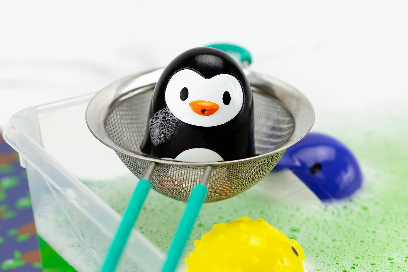 Penguin Bath Squirter on a Strainer Penguin Bath Squirter on a Strainer