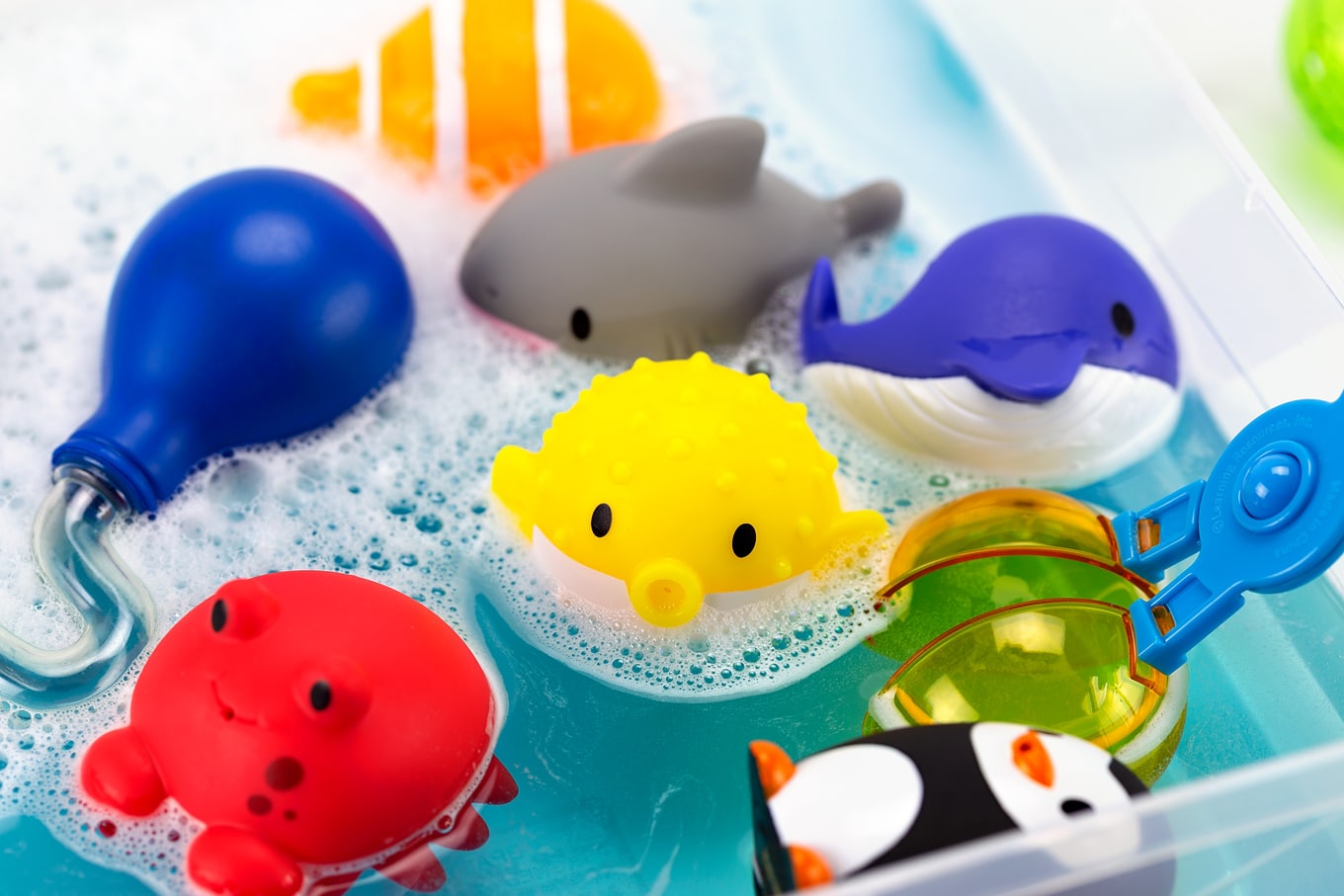 Colorful Bath Squirters in a Bubbly Water Sensory Bin Colorful Bathtub Squirters in a Bubbly Water Sensory Bin