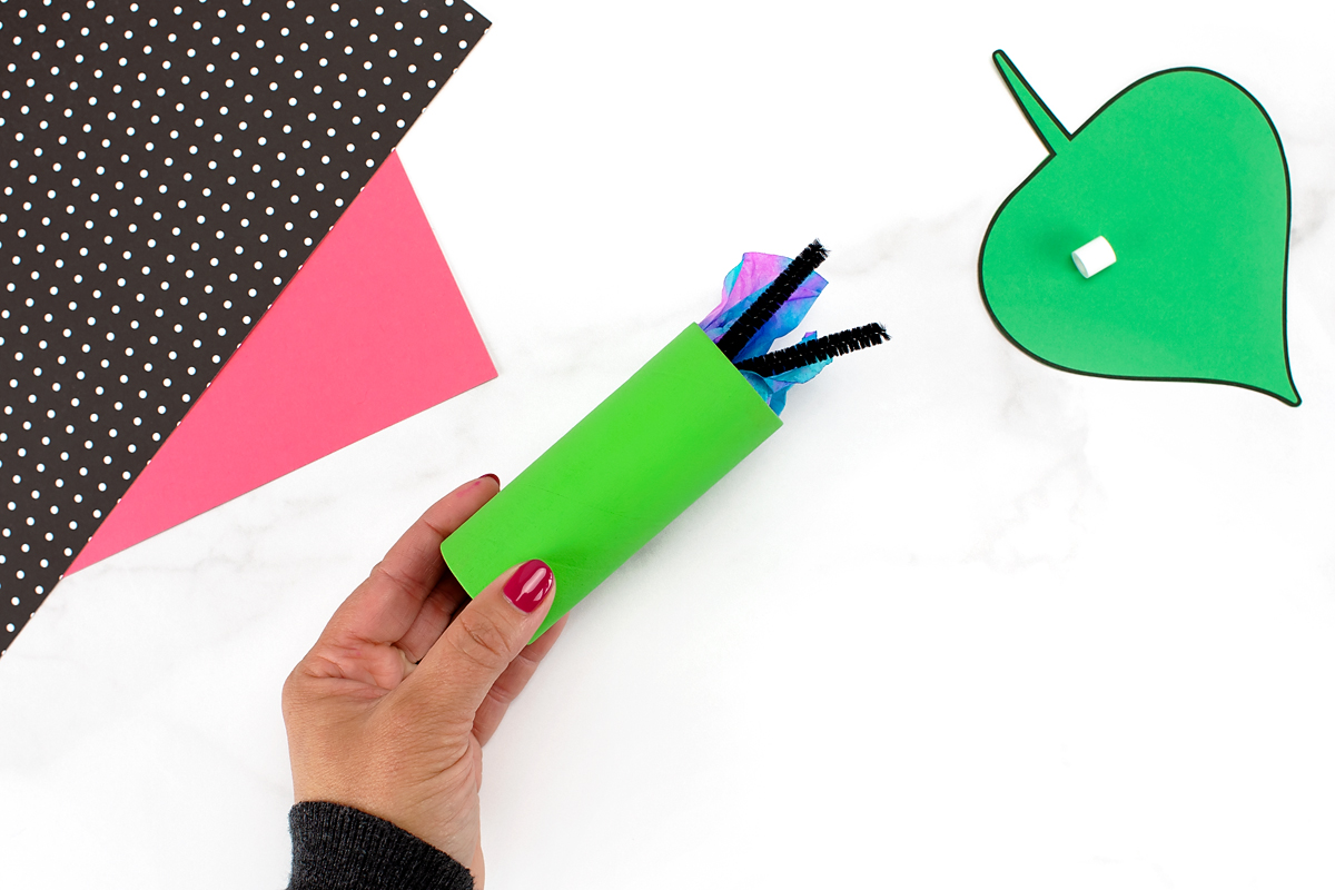 Toilet paper chrysalis with a coffee filter butterfly inside.
