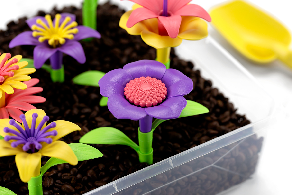 Flower Sensory Bin Build flowers in a garden sensory bin.