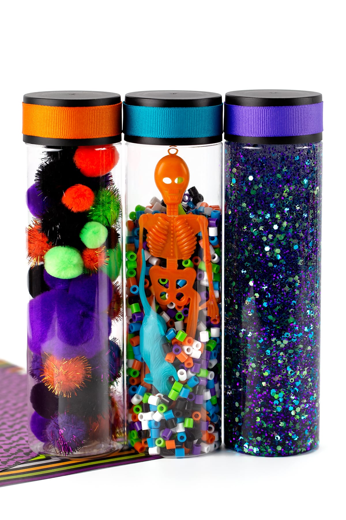Three different Halloween sensory bottles for kids to make.