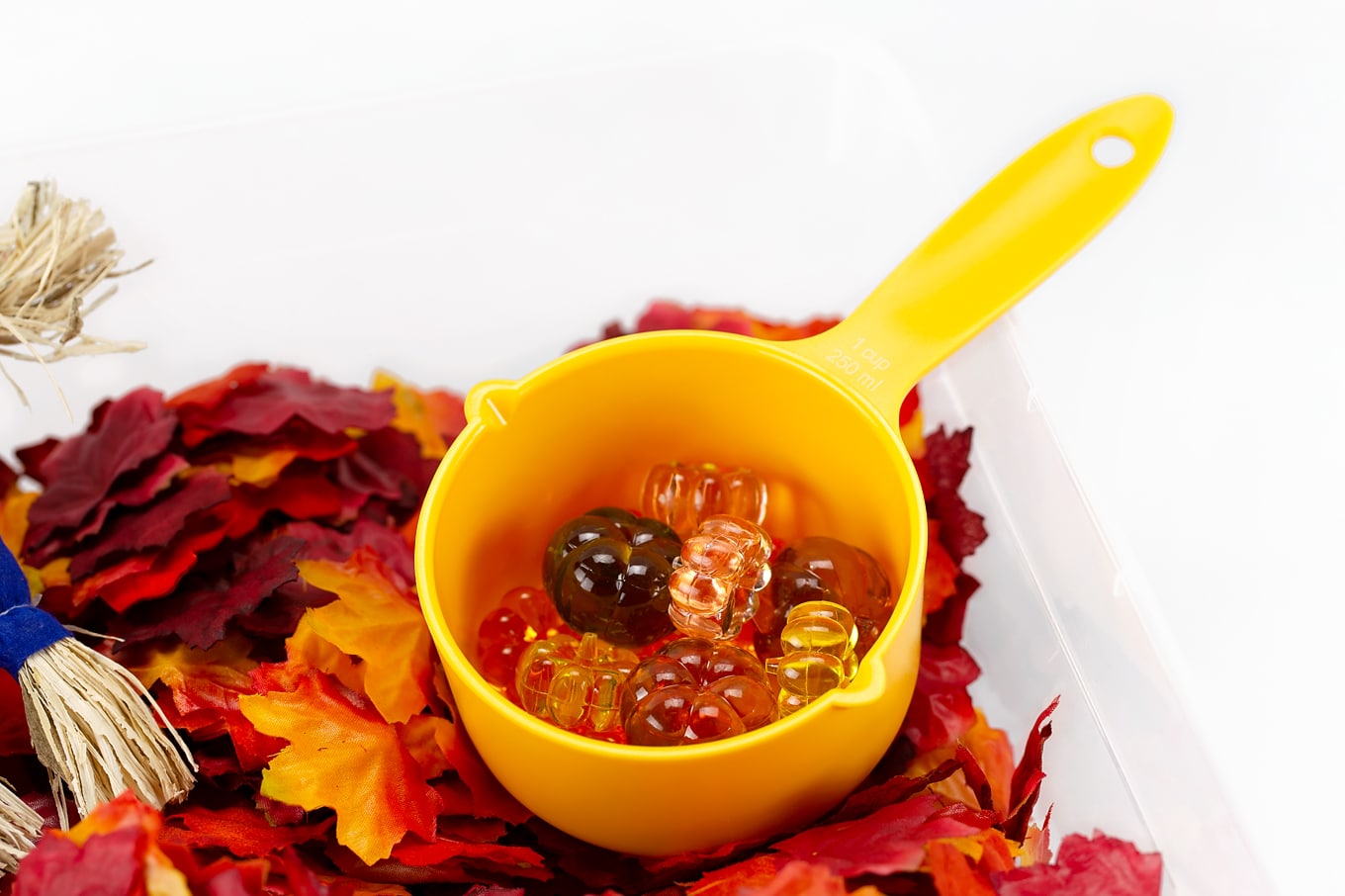 Pumpkin Gems in a Fall Sensory Bin