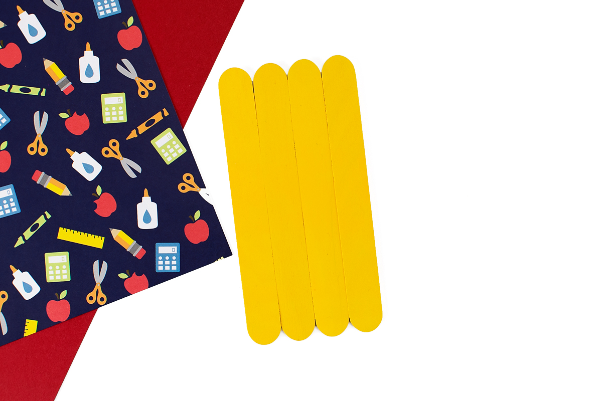 Wide craft sticks painted yellow.