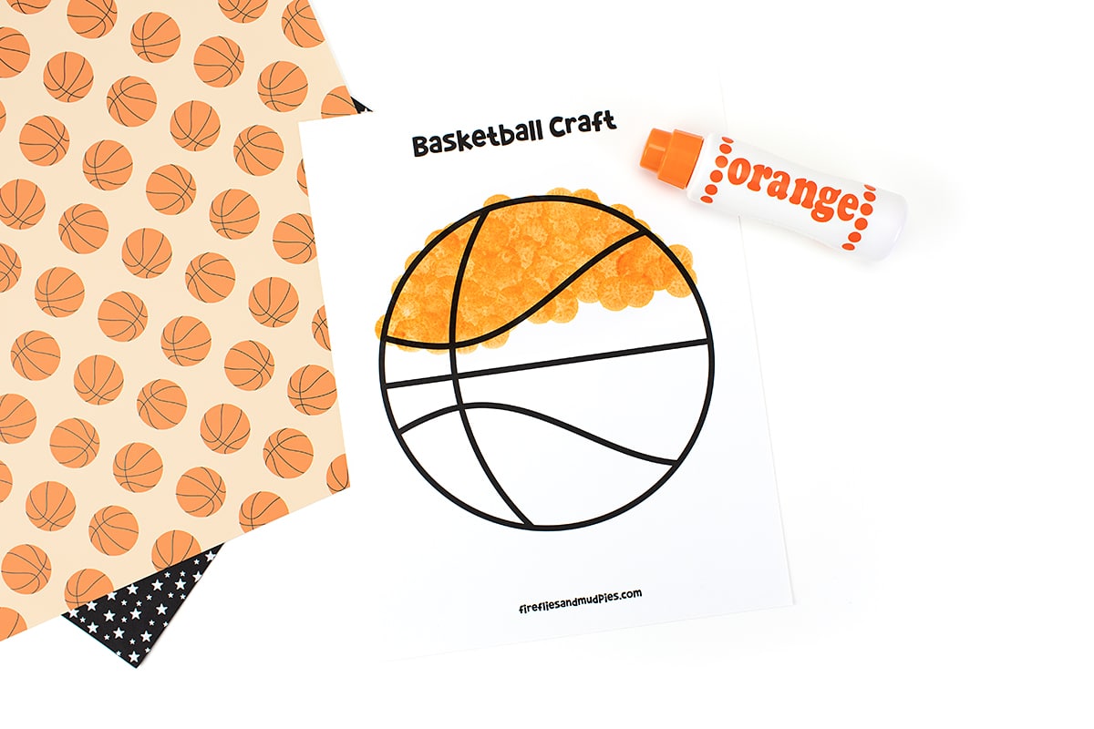 Basketball template halfway colored with an orange dot marker.