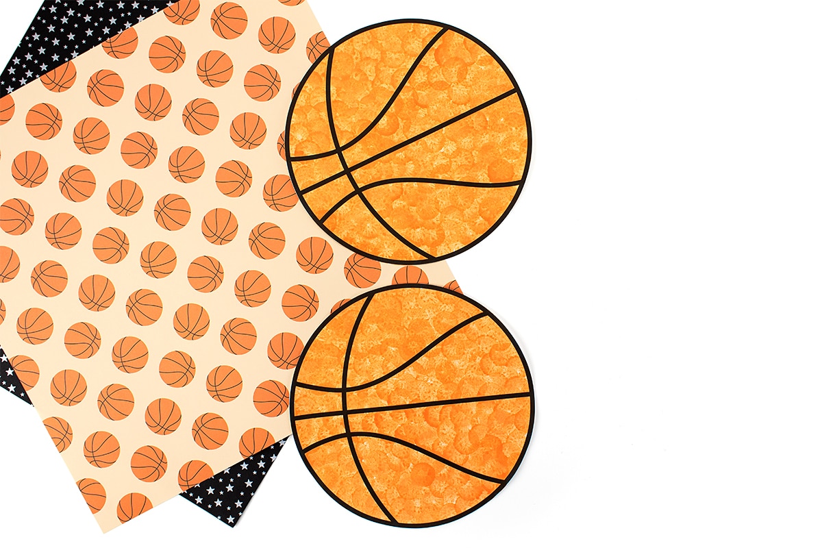 Two orange paper basketballs.