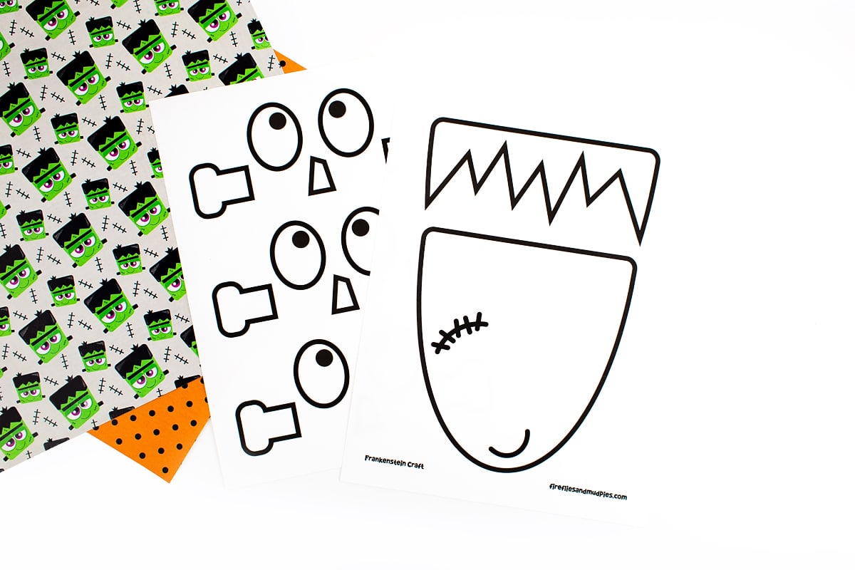 Frankenstein craft templates displayed on top of Halloween scrapbook paper.