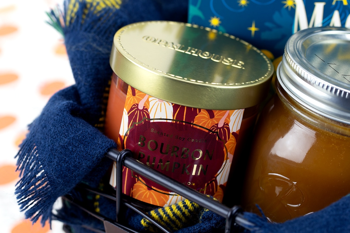A Bourbon Pumpkin scented candle inside a Boo Basket.
