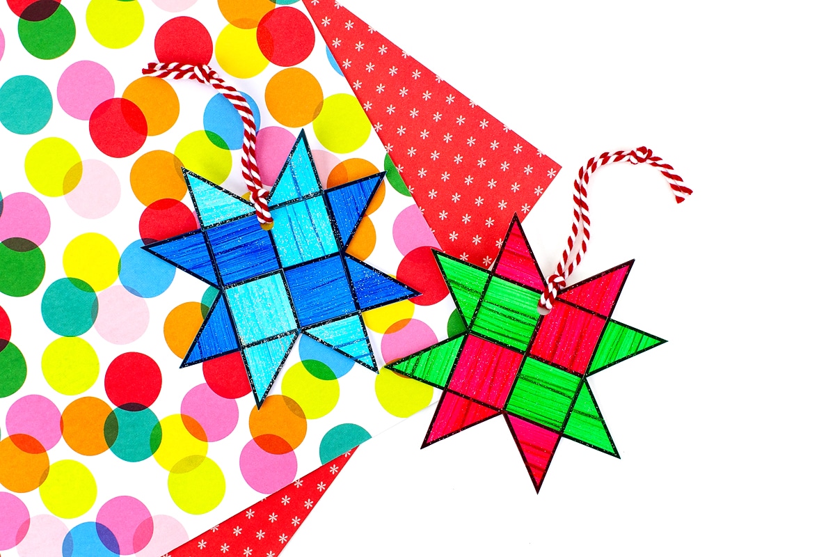 Red, green, and blue paper star ornaments for kids.
