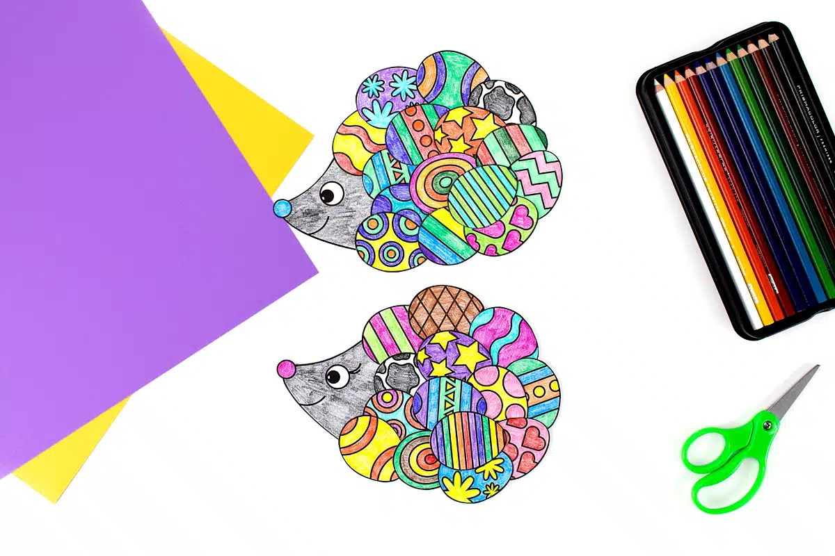 Two samples of the Easter Hedgehog Craft with scissors and pencils.