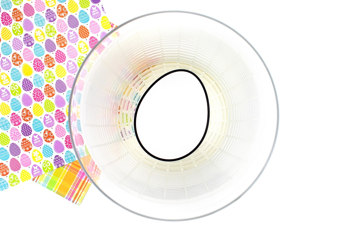 Easter egg template inside basket of salad spinner.