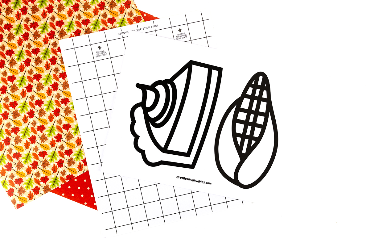 Thanksgiving suncatcher templates on a table.