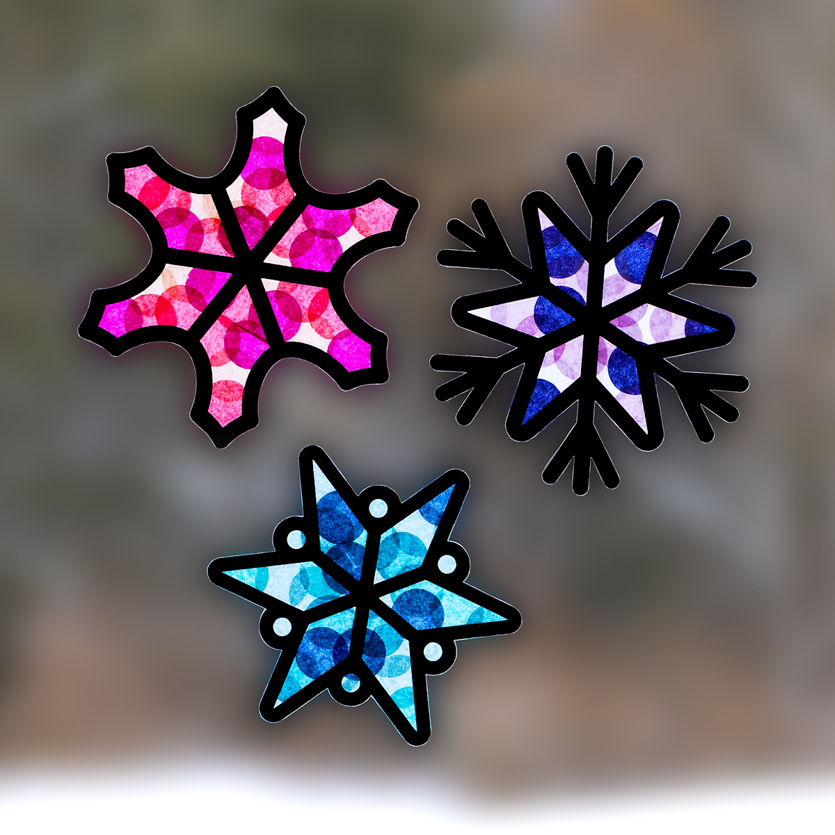 Three beautiful snowflake suncatchers for kids.
