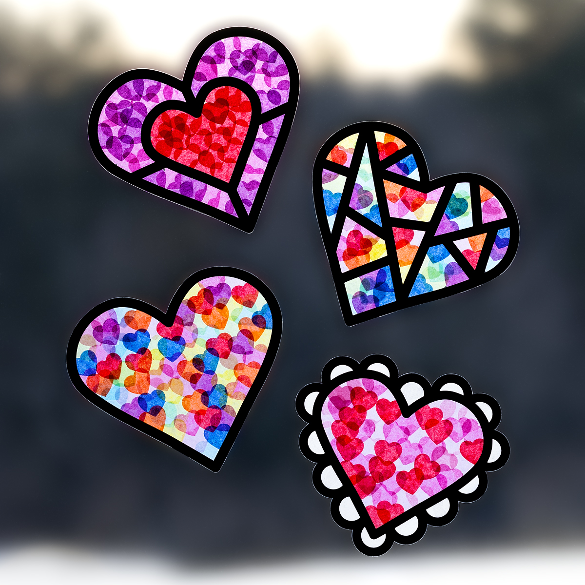 Valentine Suncatchers hanging in a window.