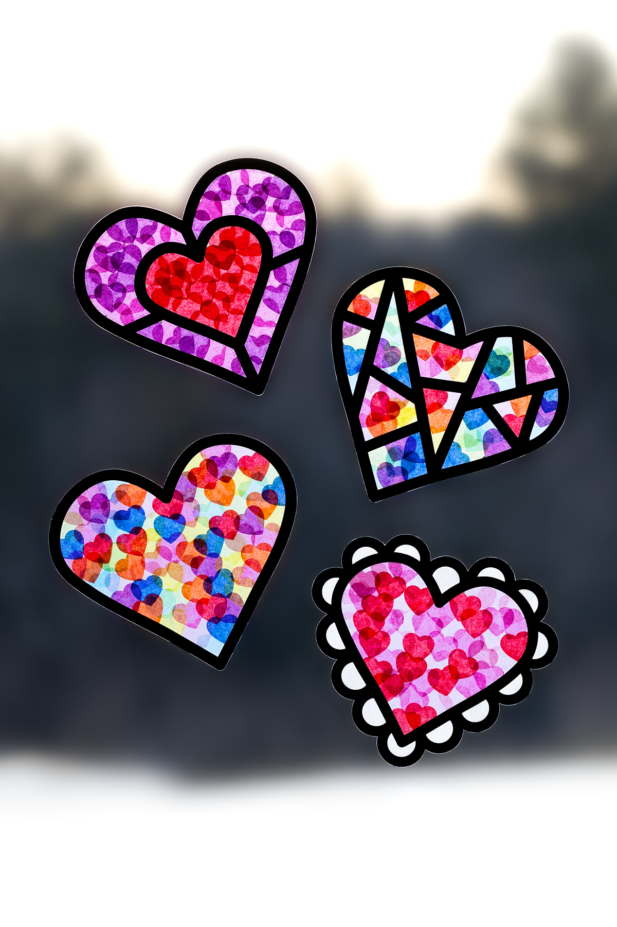 Valentine Suncatchers hanging in a window.