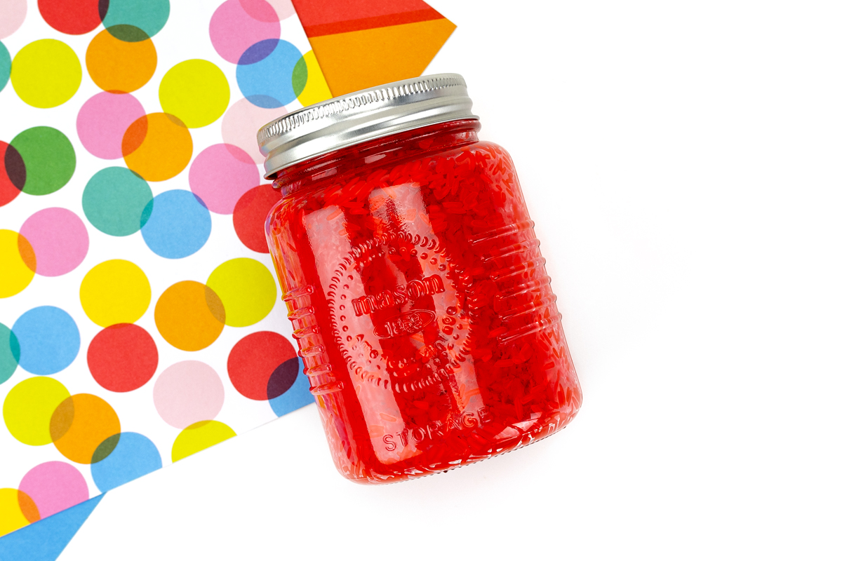 Red dyed rice in a mason jar.
