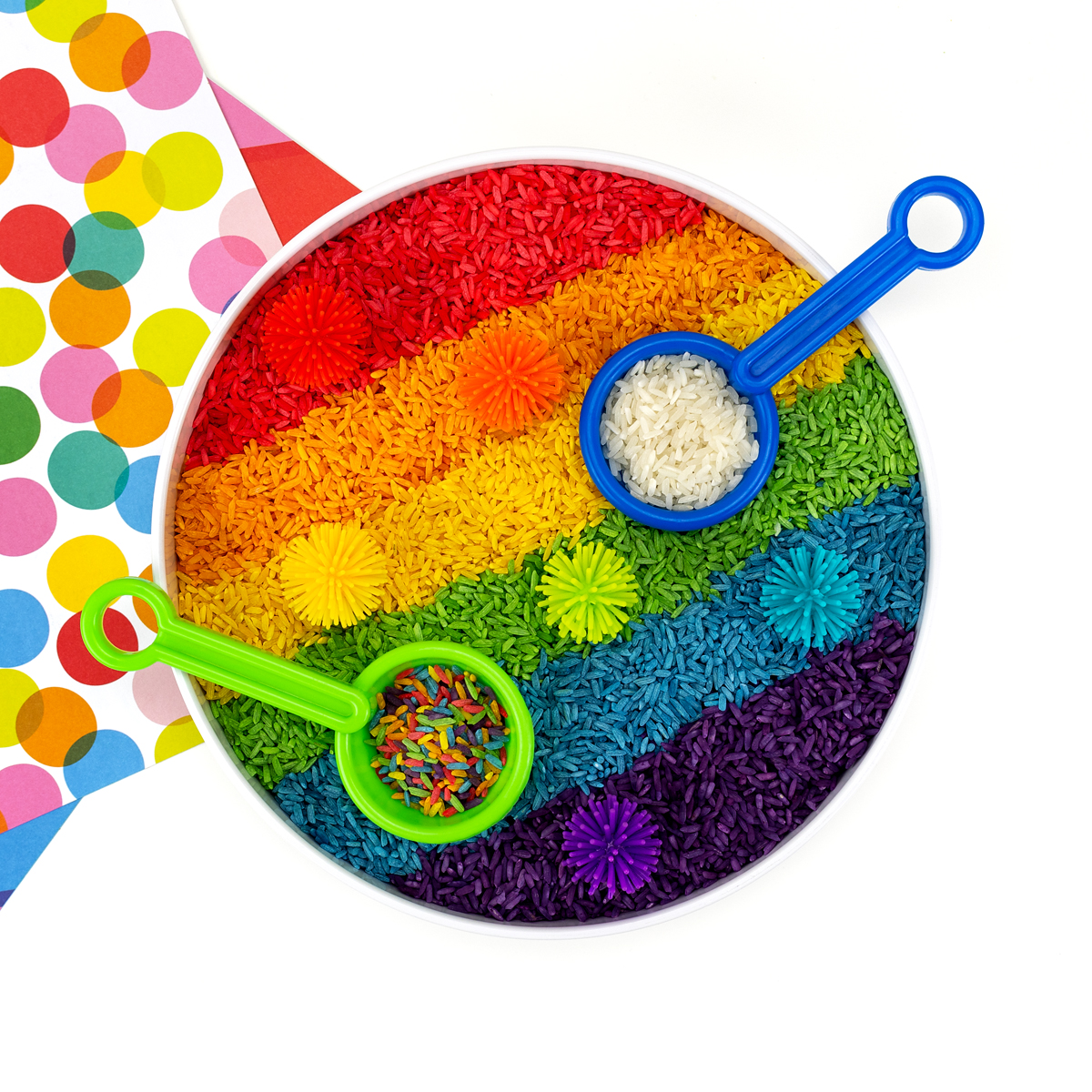 Rainbow rice in a sensory bin.