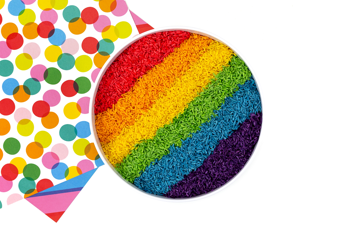 Rainbow rice on a white tray.