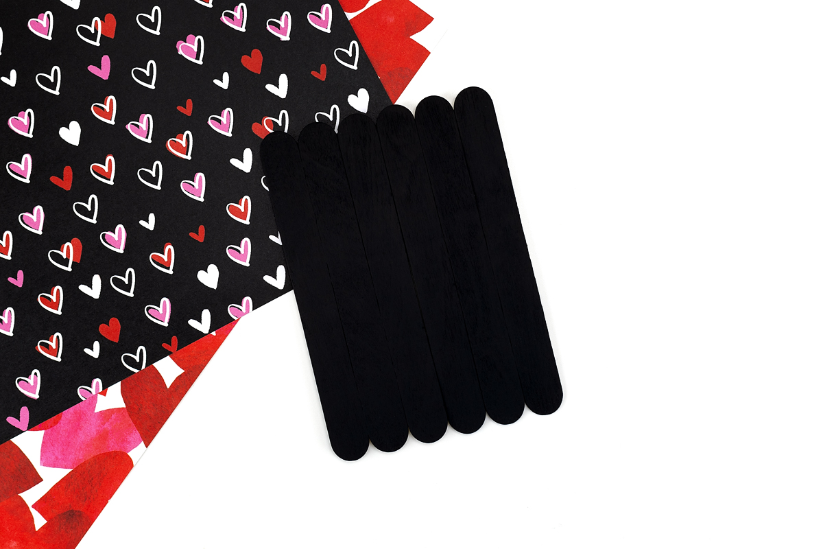 Popsicle stick base painted black.