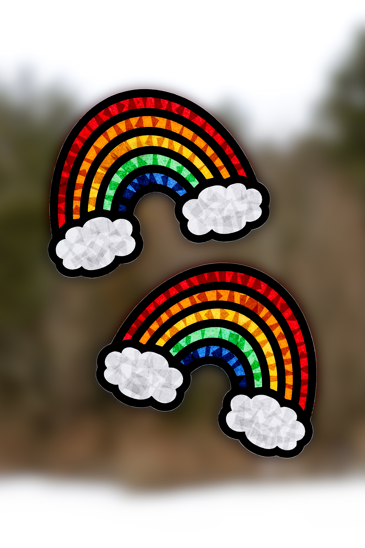 Two beautiful rainbow suncatchers hanging in a window.