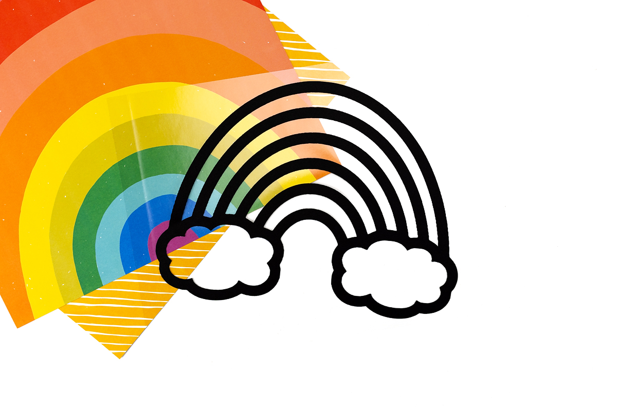 Rainbow suncatcher outline on sticky contact paper.