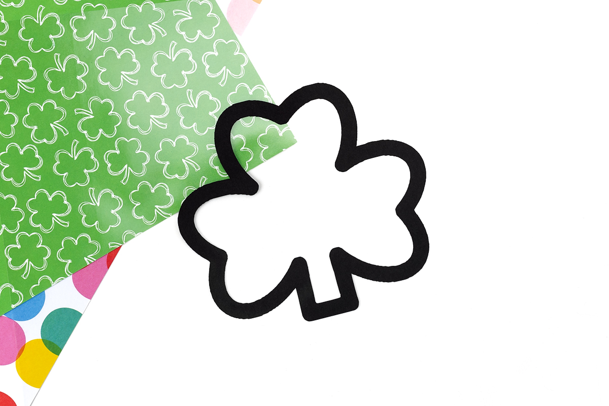 Shamrock suncatcher frame on sticky paper.