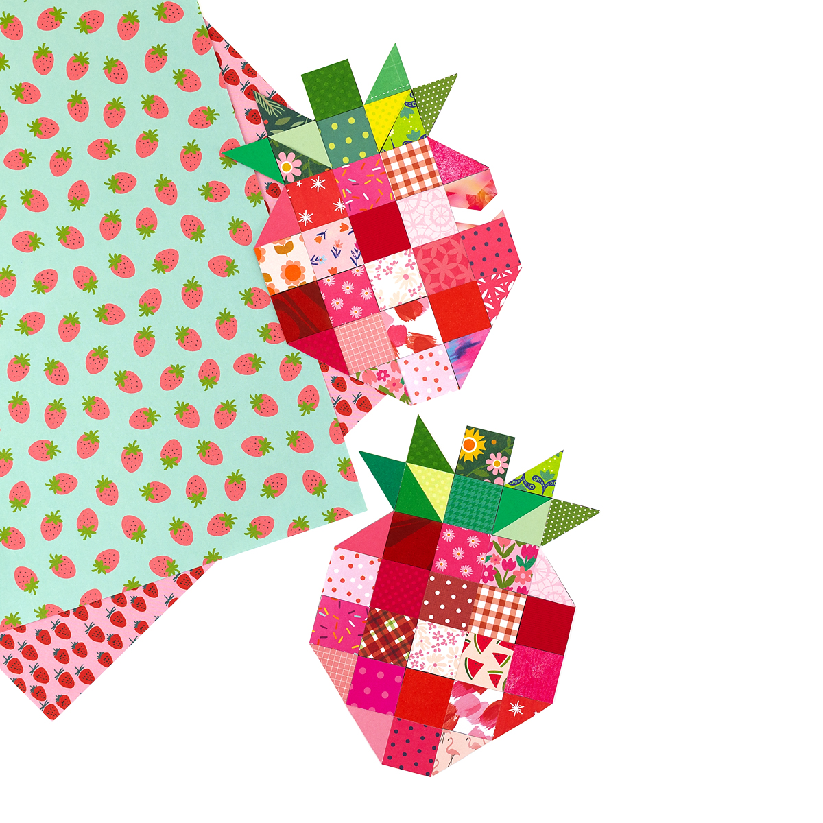Two quilted strawberry paper crafts.