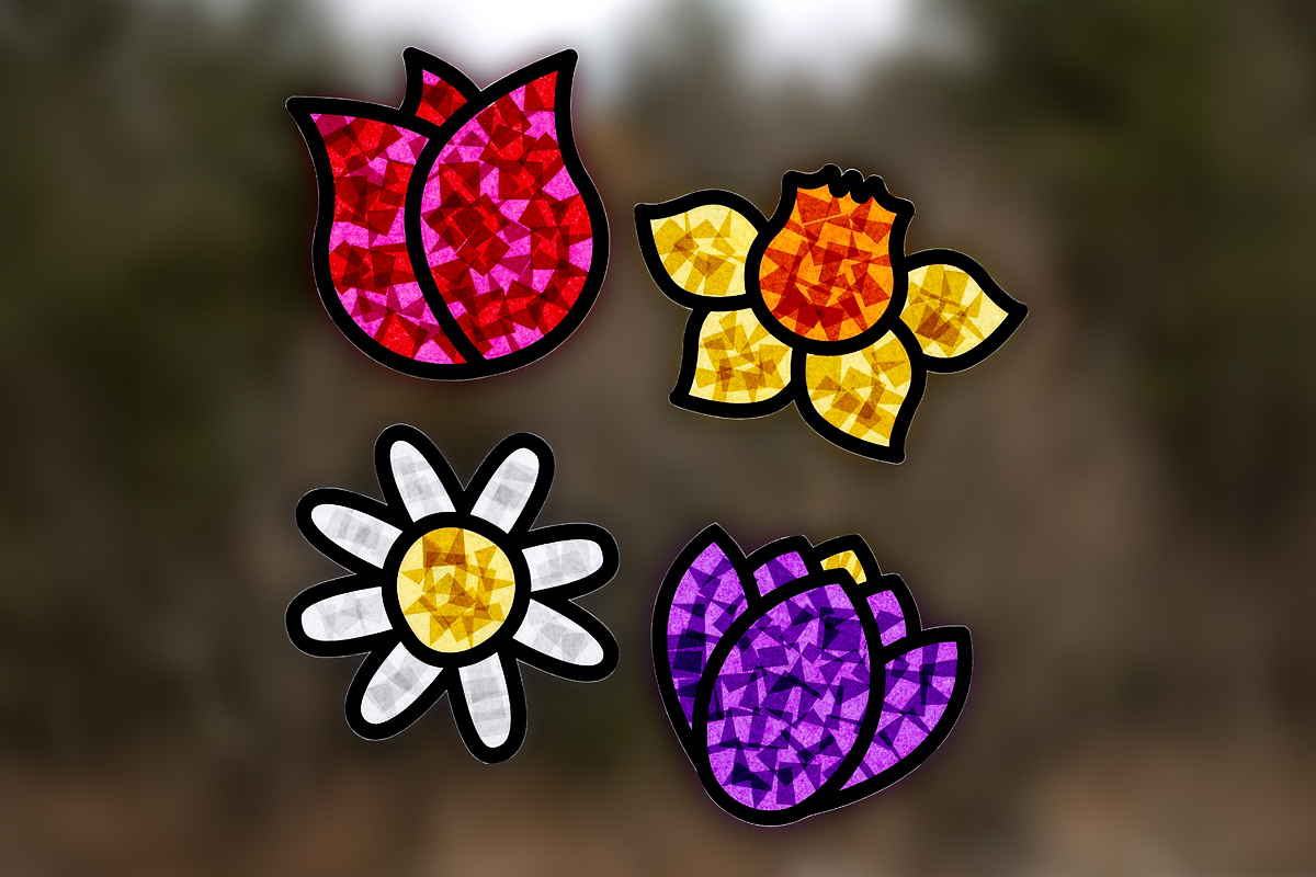 Finished flower suncatchers hanging on a window.