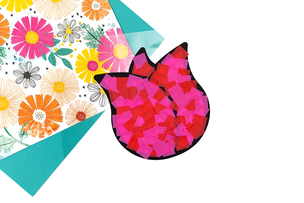 Tulip suncatcher frame filled in with tissue paper.