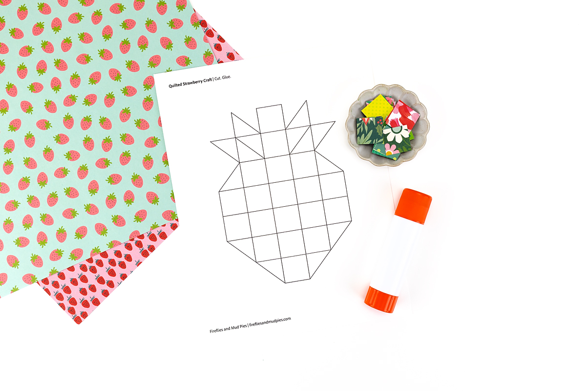 Supplies needed to make a paper strawberry craft.