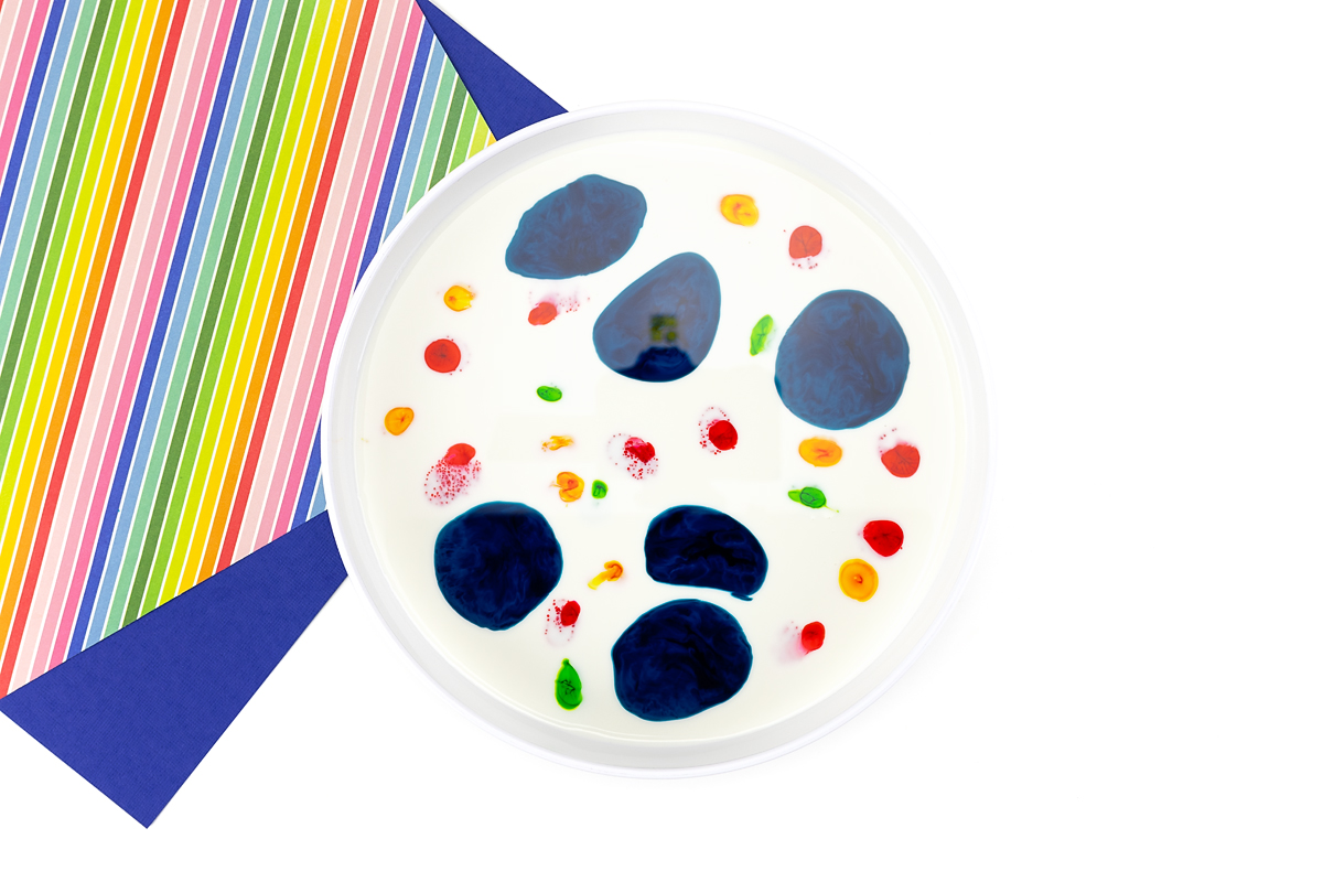 Food coloring dripped onto milk.