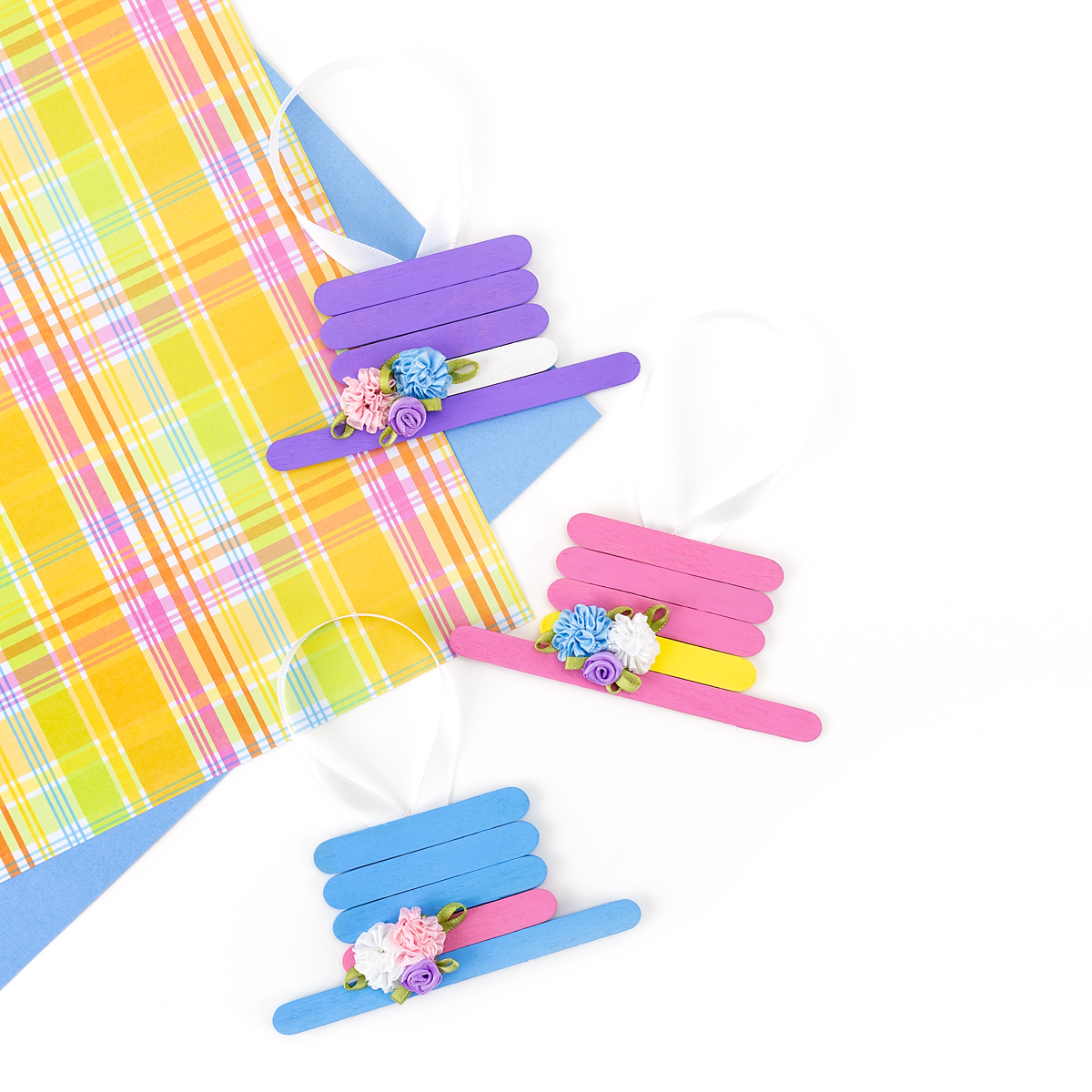 3 popsicle stick Easter bonnet decorations.