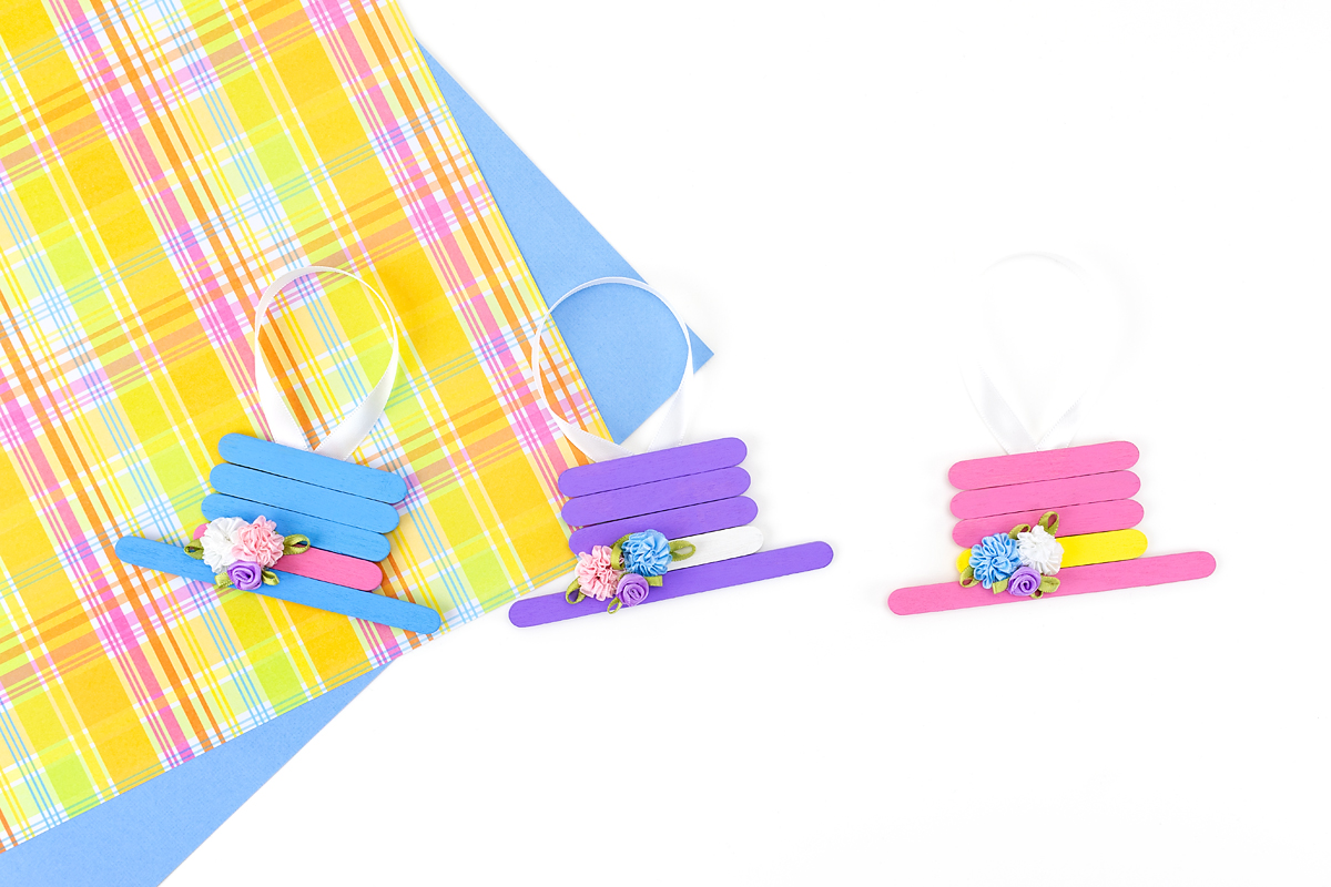 Blue, purple, and pink Easter bonnets lined up in a row.