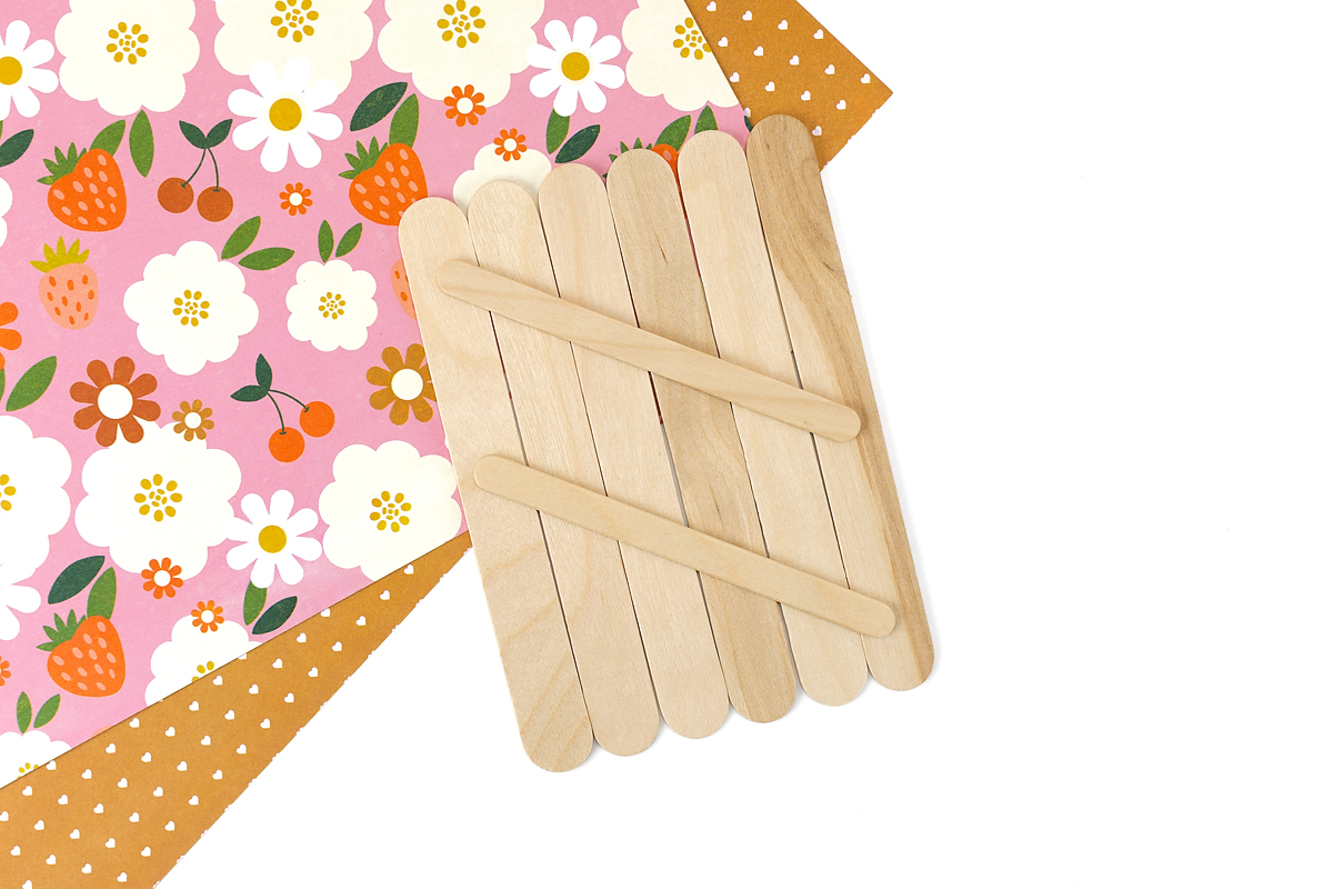 Popsicle stick base for strawberry craft.
