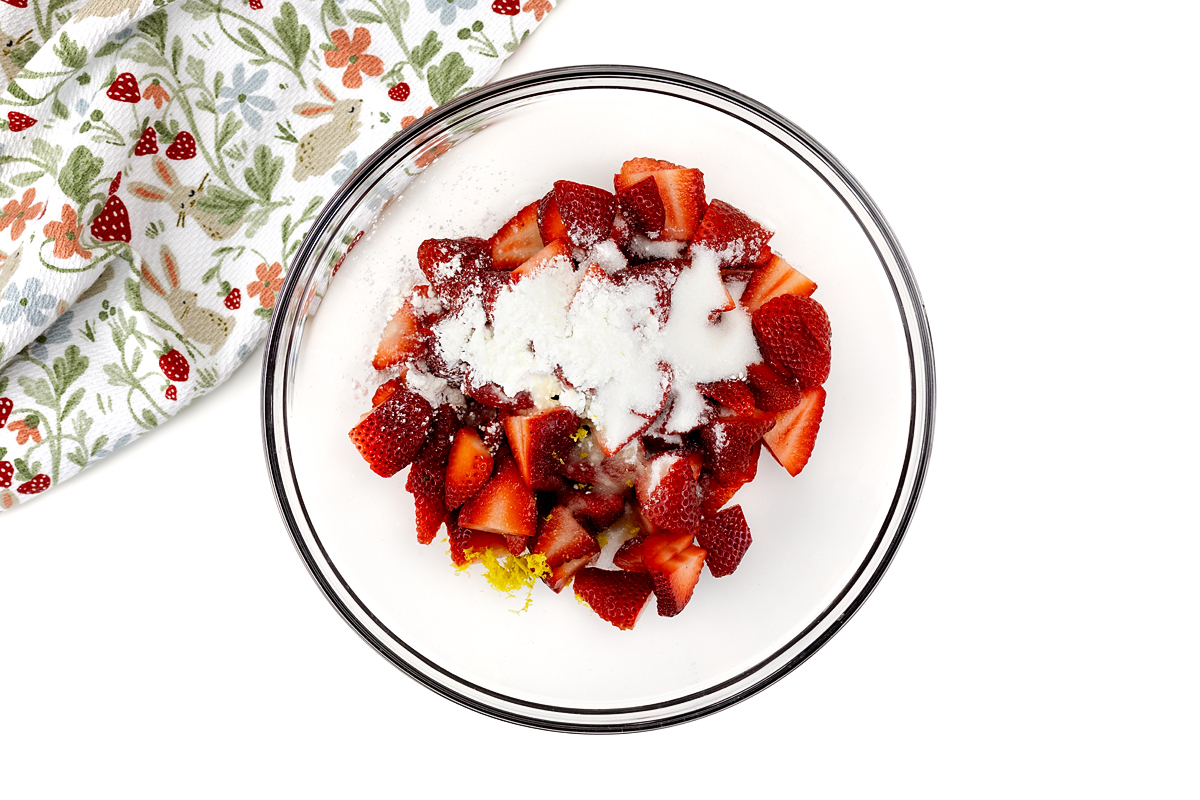 Strawberry filling in a glass bowl.