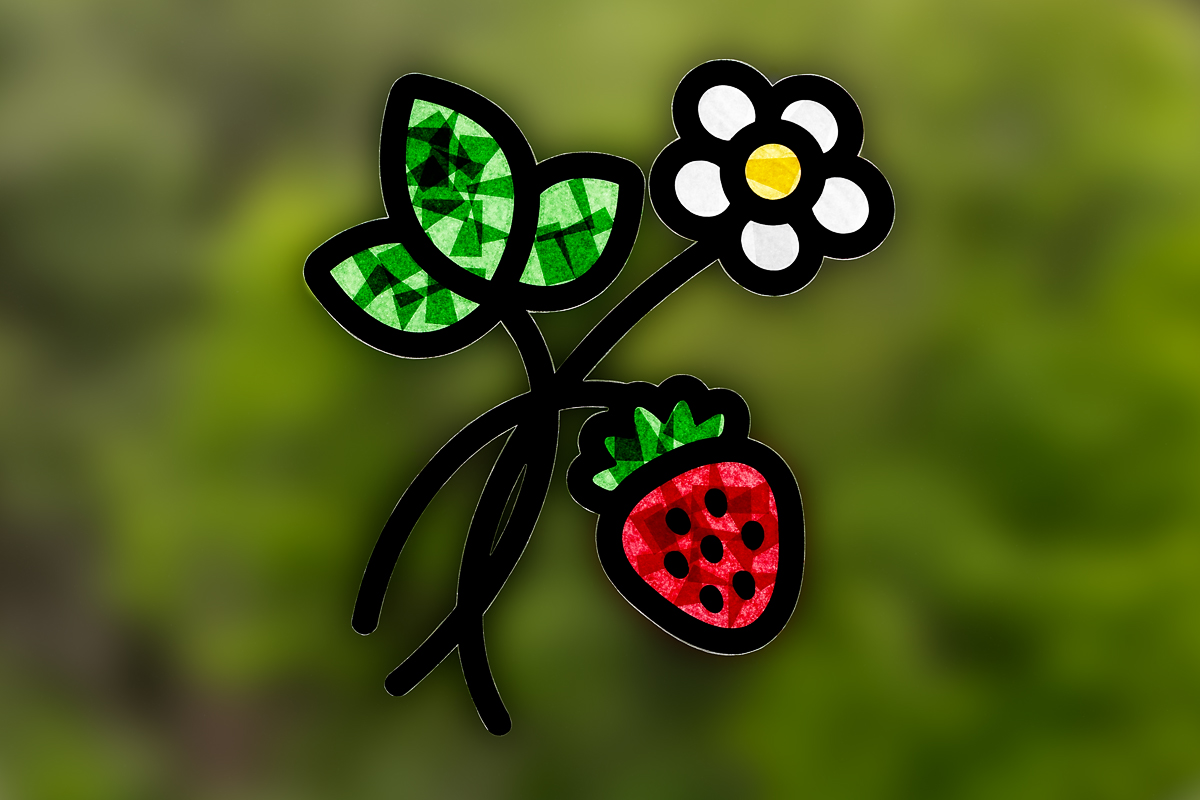 Finished Strawberry Suncatcher hanging in a window.