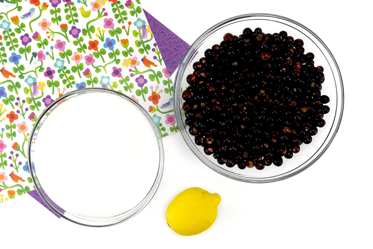 Sugar, blackcurrants, and lemon—ingredients for blackcurrant jam.