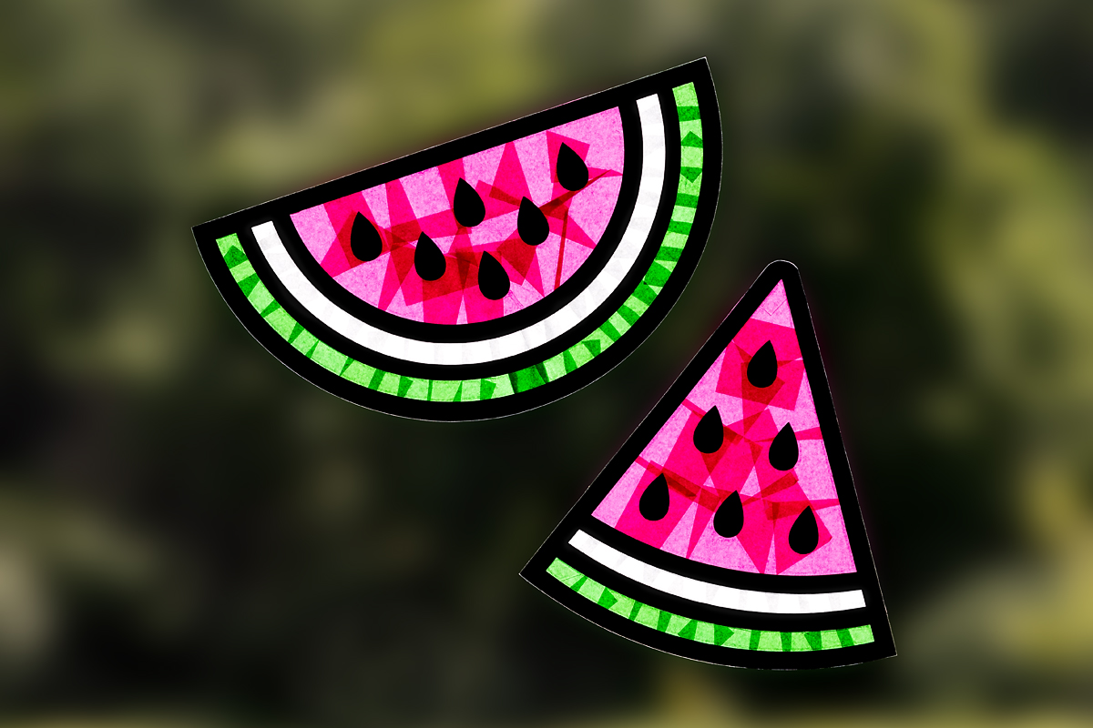 Watermelon suncatchers hanging on a window.