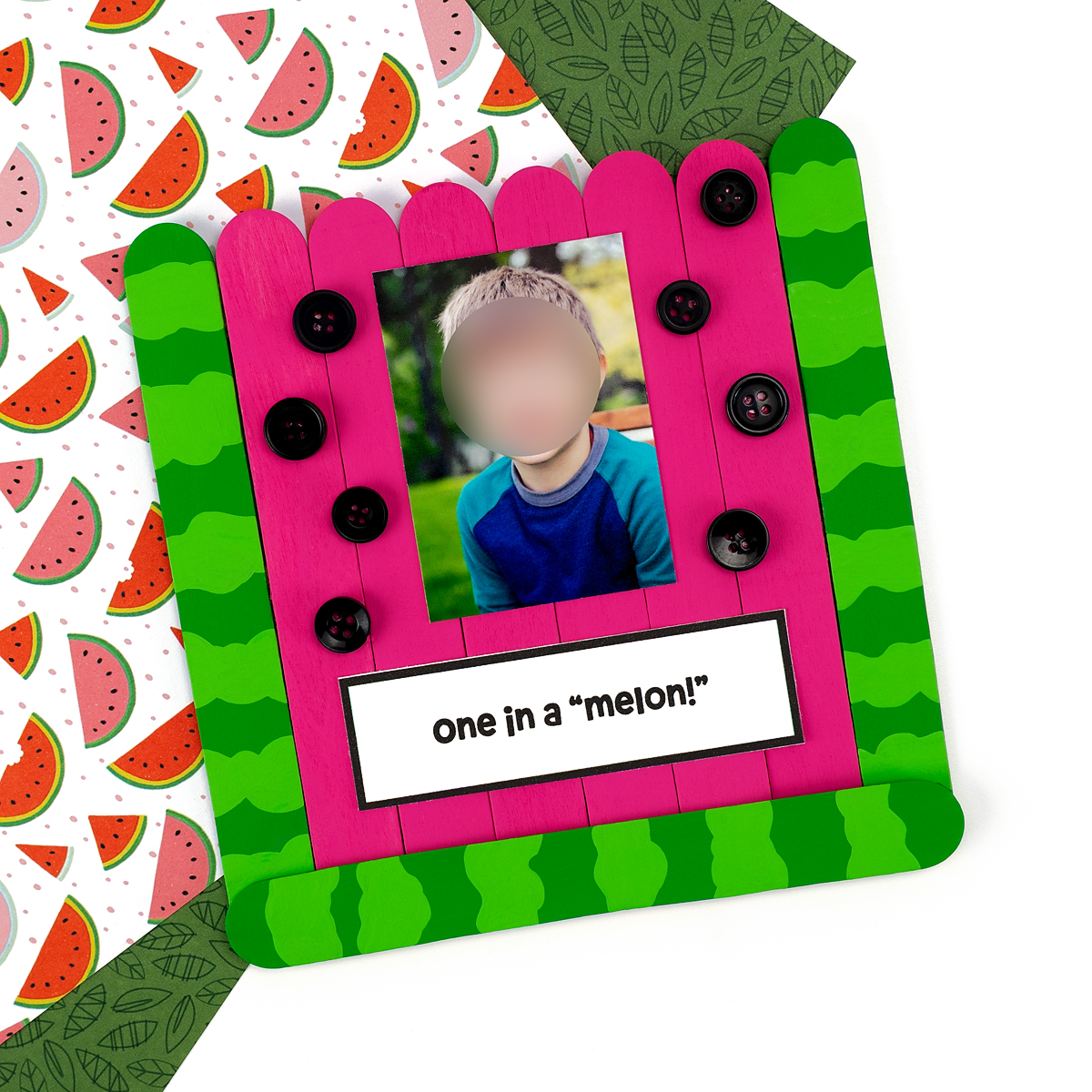 Finished watermelon craft on a colorful background.
